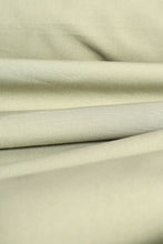 Load image into Gallery viewer, Close-up of beige fabric with folds