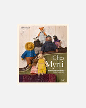 Load image into Gallery viewer, Book cover for 'Chez Myrtil' by Cinthia Vallet, featuring a group of knitted and plush stuffed animals posed on a green sofa against a patterned wallpaper background.