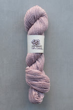 Load image into Gallery viewer, Ball of pink yarn with a label on a gray background