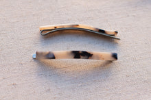 Load image into Gallery viewer, Two tortoiseshell hair clips on a textured beige surface