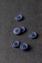 Load image into Gallery viewer, Blue buttons on a textured gray surface
