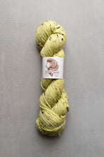 Load image into Gallery viewer, Yellow skein of yarn with a label on a gray background