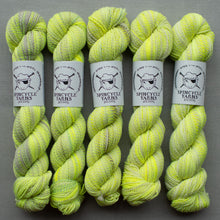 Load image into Gallery viewer, Five skeins of green yarn with labels on a gray background