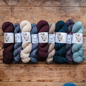 row of various colored yarn hanks