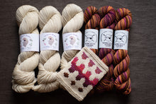 Load image into Gallery viewer, Three skeins of yarn in beige and multicolor with a knitted swatch on a dark surface.