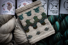 Load image into Gallery viewer, Knitted item with yarn and Spincycle Yarns branding in the background