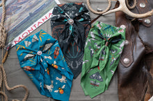 Load image into Gallery viewer, Three decorative bows with intricate patterns on a textured surface with 'Montana' branding.