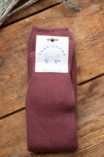 Load image into Gallery viewer, Maroon sock with a 'Tabbisocks' label on a wooden surface