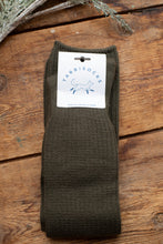 Load image into Gallery viewer, Brown sock with a Tabbisocks label on a wooden surface
