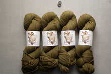 Load image into Gallery viewer, Four skeins of green yarn with labels on a gray background