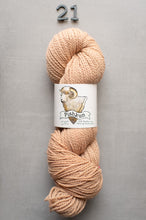 Load image into Gallery viewer, Beige skein of yarn with a label on a gray background