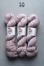 Load image into Gallery viewer, Three skeins of pink yarn with labels on a gray background