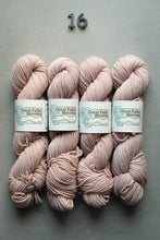 Load image into Gallery viewer, Four skeins of pink yarn with labels on a gray background