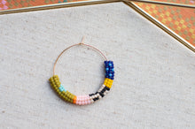 Load image into Gallery viewer, Colorful beaded hoop on a textured fabric background