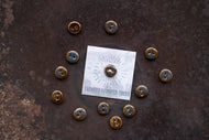 brown buttons on flat surface