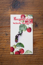 Load image into Gallery viewer, Raspberry stitch marker on a wooden surface