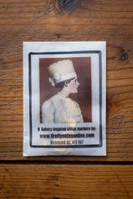 Load image into Gallery viewer, Stitch markers packaging with a vintage-style illustration on a wooden surface