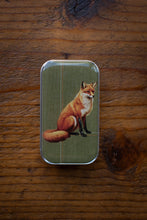 Load image into Gallery viewer, Small tin box with a fox illustration on a wooden surface