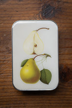 Load image into Gallery viewer, Rectangular tin with pear illustration on a wooden surface