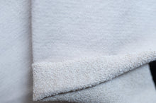 Load image into Gallery viewer, Close-up of a textured white fabric corner