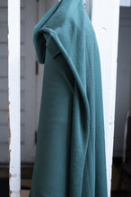 Load image into Gallery viewer, Teal towel hanging on a white metal rack
