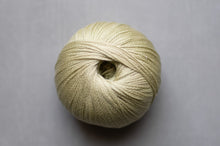 Load image into Gallery viewer, Ball of beige yarn on a gray background