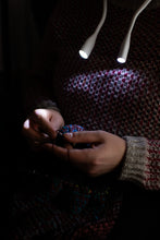 Load image into Gallery viewer, person knitting using hoodie lights