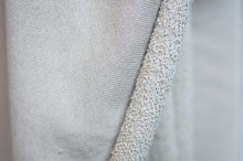 Load image into Gallery viewer, Close-up of textured gray fabric with a subtle pattern