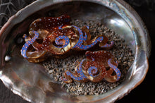 Load image into Gallery viewer, Decorative seashell with blue and gold octopus designs on a dark background