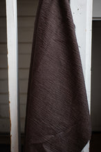 Load image into Gallery viewer, Brown textured fabric draped over a white wooden frame