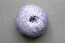 Load image into Gallery viewer, Ball of light purple yarn on a gray background