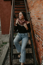 Load image into Gallery viewer, Woman sitting on a ladder against a brick wall