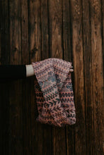 Load image into Gallery viewer, Knitted scarf with a pattern against a wooden background