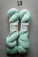 Load image into Gallery viewer, Two skeins of mint green yarn with labels on a gray background