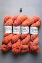 Load image into Gallery viewer, Four skeins of pink yarn with labels on a gray background