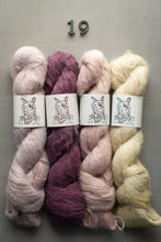 Load image into Gallery viewer, Four skeins of yarn in pink, purple, and beige with 'Oh Dang' labels on a gray background.