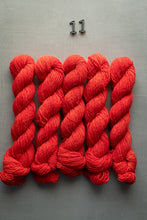 Load image into Gallery viewer, Red yarn skeins on a gray background with a number '11' above.