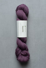 Load image into Gallery viewer, Purple skein of yarn with a label on a gray background