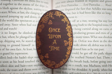 Load image into Gallery viewer, Decorative stone with 'Once Upon a Time' text on an open book