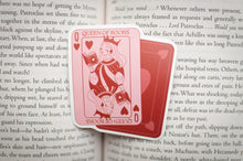 Load image into Gallery viewer, Queen of Hearts playing card on an open book