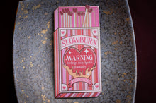 Load image into Gallery viewer, Pink matchbox with 'Slowburn' and 'Warning' text on a textured surface