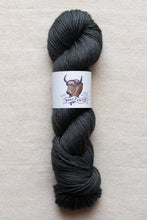 Load image into Gallery viewer, Gray skein of yarn with a label on a beige background