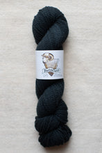 Load image into Gallery viewer, Dark blue skein of yarn with a label on a light gray background