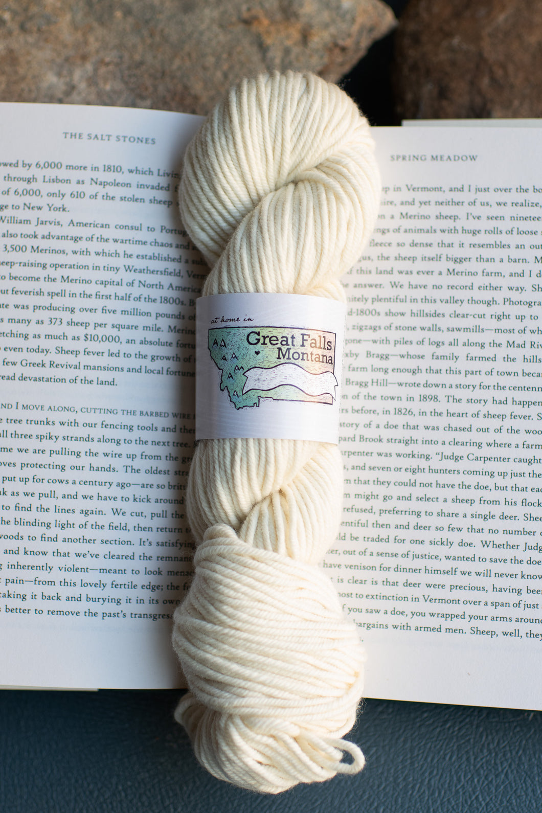 cream-colored skein on open book