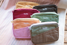Load image into Gallery viewer, Set of colorful bags with 'Socila' branding on a wooden surface.