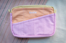Load image into Gallery viewer, Two-tone pink and purple pouch with 'Scolla' branding on a textured surface.