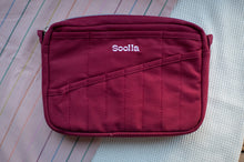 Load image into Gallery viewer, Maroon bag with 'Soolala' branding on a striped fabric background