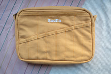 Load image into Gallery viewer, Beige crossbody bag with 'Soolia' branding on a textured surface