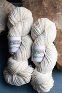 two skeins of white yarn