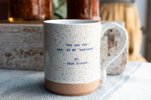 Load image into Gallery viewer, A ceramic mug with a speckled off-white glaze, a brown base, and blue printed text reading 'YOU ARE THE', 'SHE' TO MY 'NANIGANS', 'XO, YOUR SISTER'.